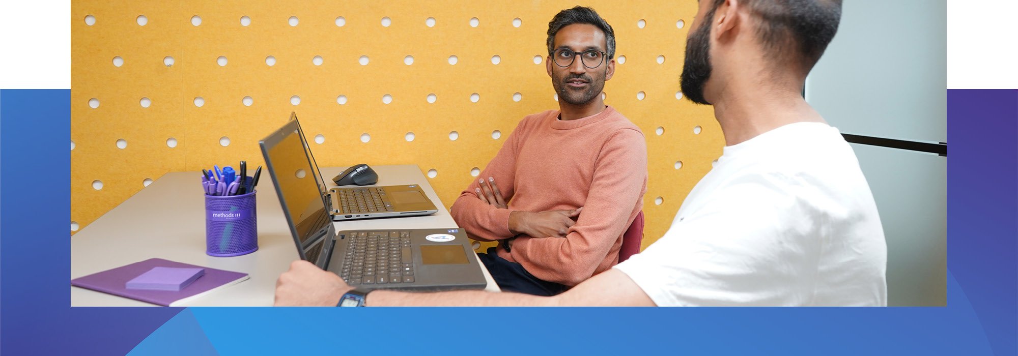 Decorative photo of Methods employees working in the Methods office meeting room