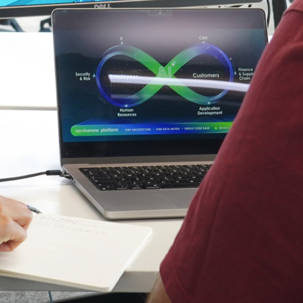 Decorative photo of a Methods employee working on a desk in the office