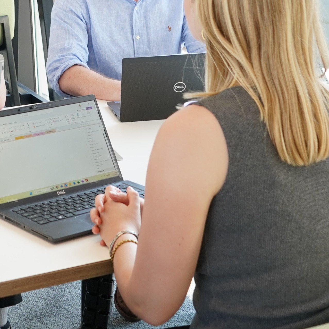 Decorative photo of Methods employees working on a desk in the office
