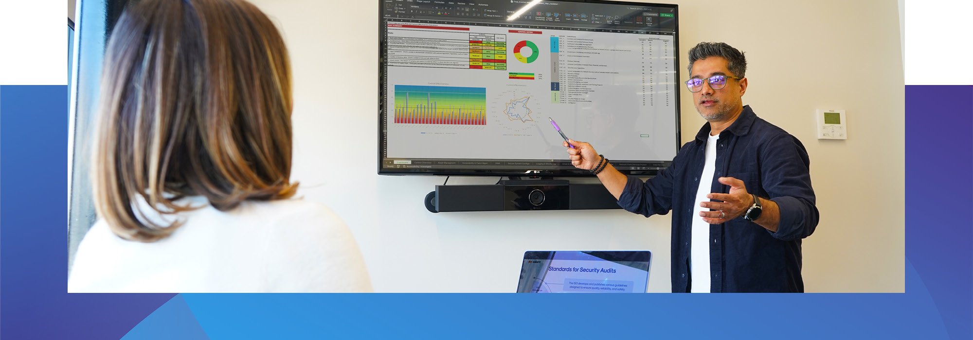Decorative photo of a Methods employee presenting data statistics to another colleague in the Methods office