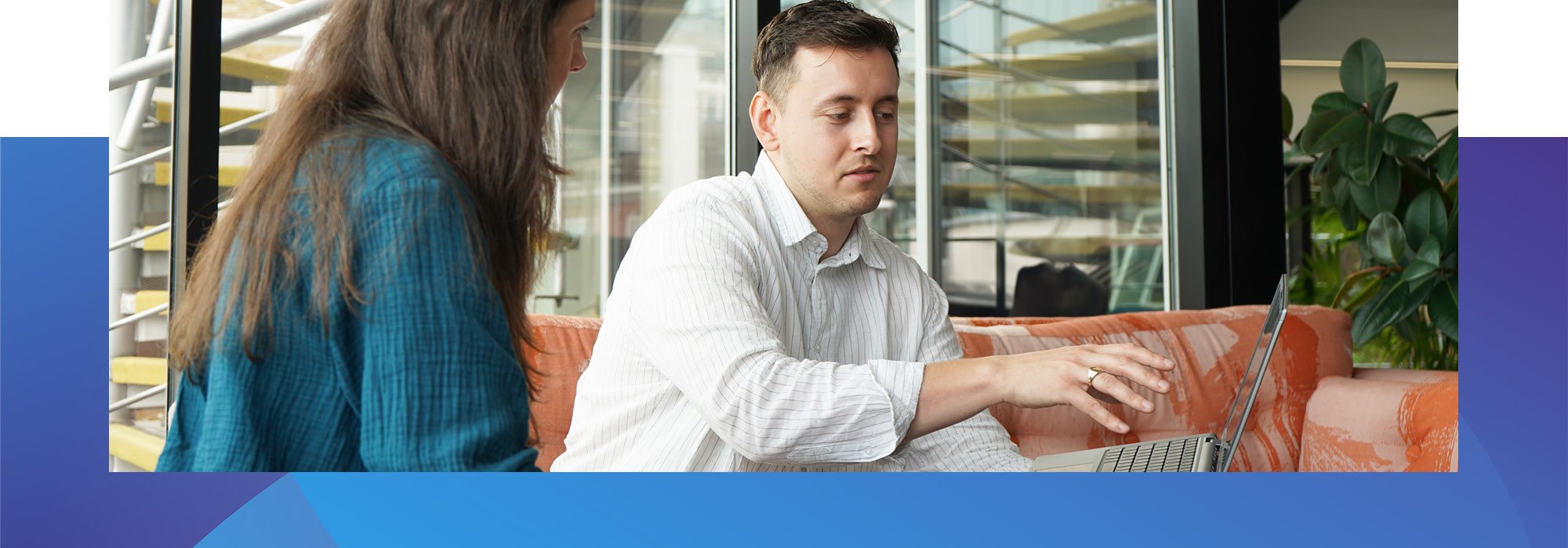 Decorative photo of Methods employees discussing work on a sofa in the Methods office