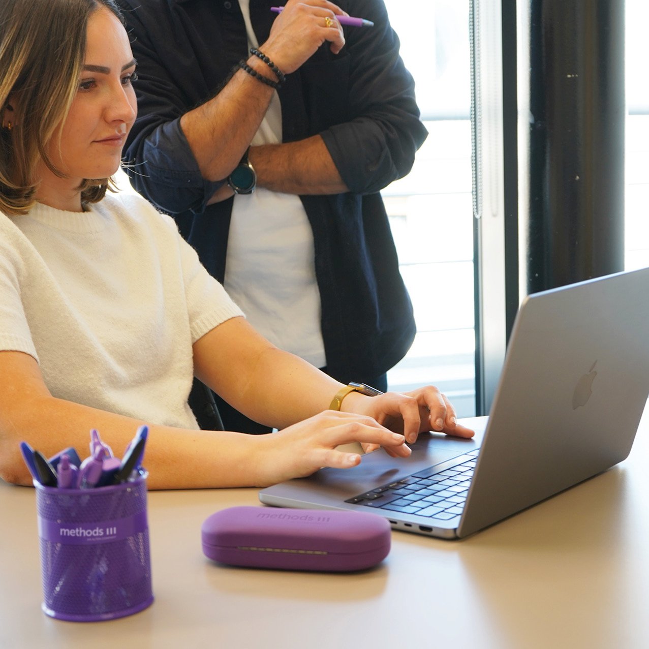 Decorative photo of Methods employees working together in the office